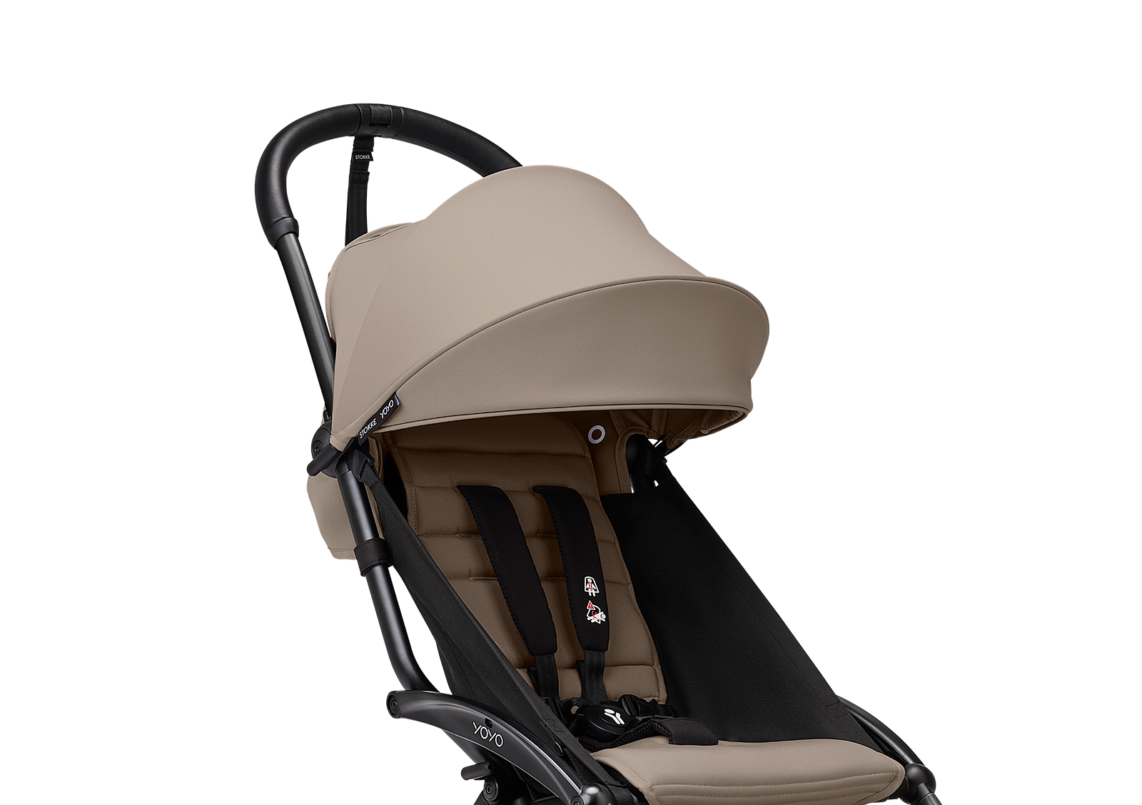 A beige and black STOKKE YOYO stroller against a black background.