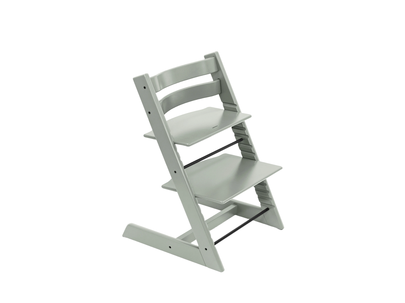 Light gray Tripp Trapp chair on a black background.