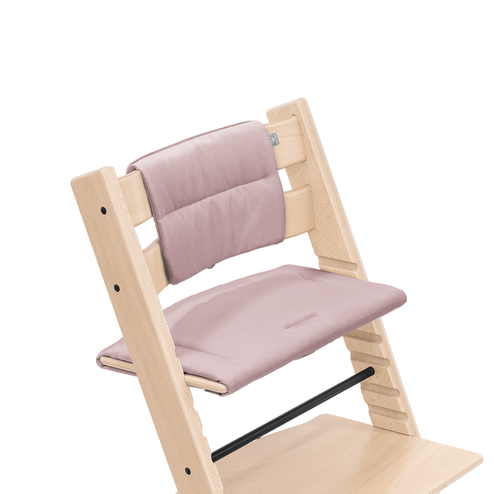Tripp Trapp chair in natural wood with pink cushions.