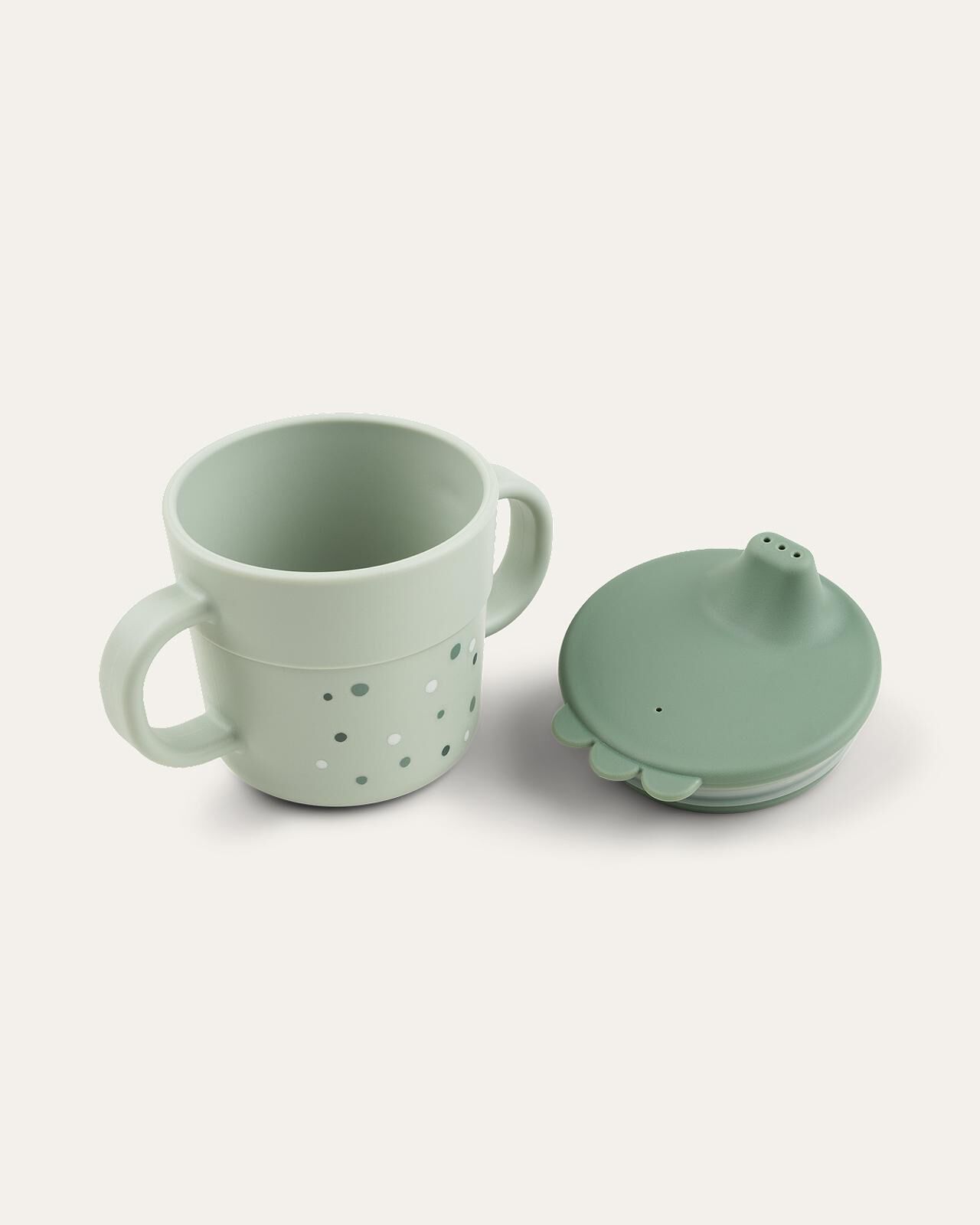 Foodie tuitbeker Lichtgroene babybeker met handvatten, stippen en een donkergroen tuitdeksel.