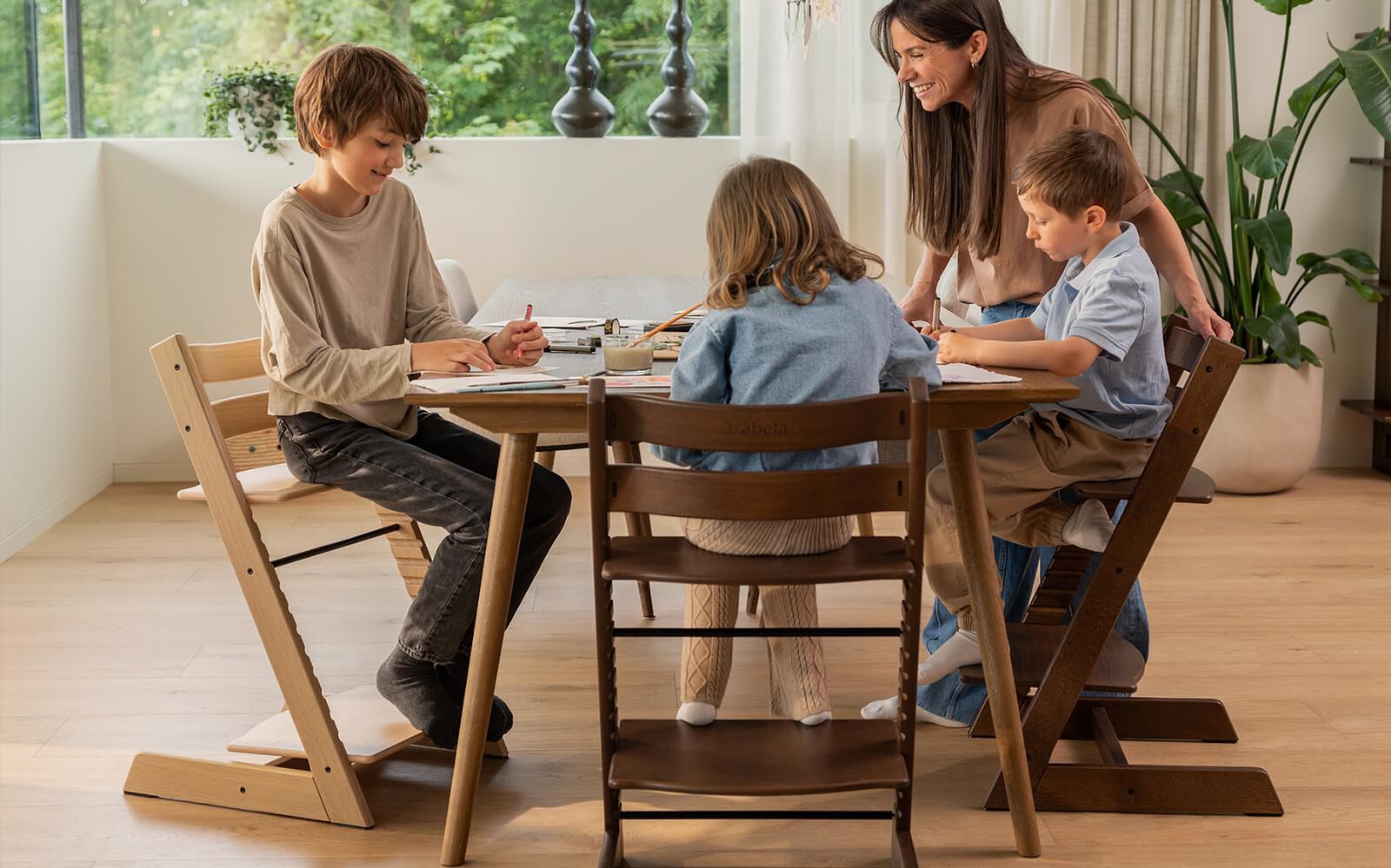 Kid on a highchair in kitchen with an adult