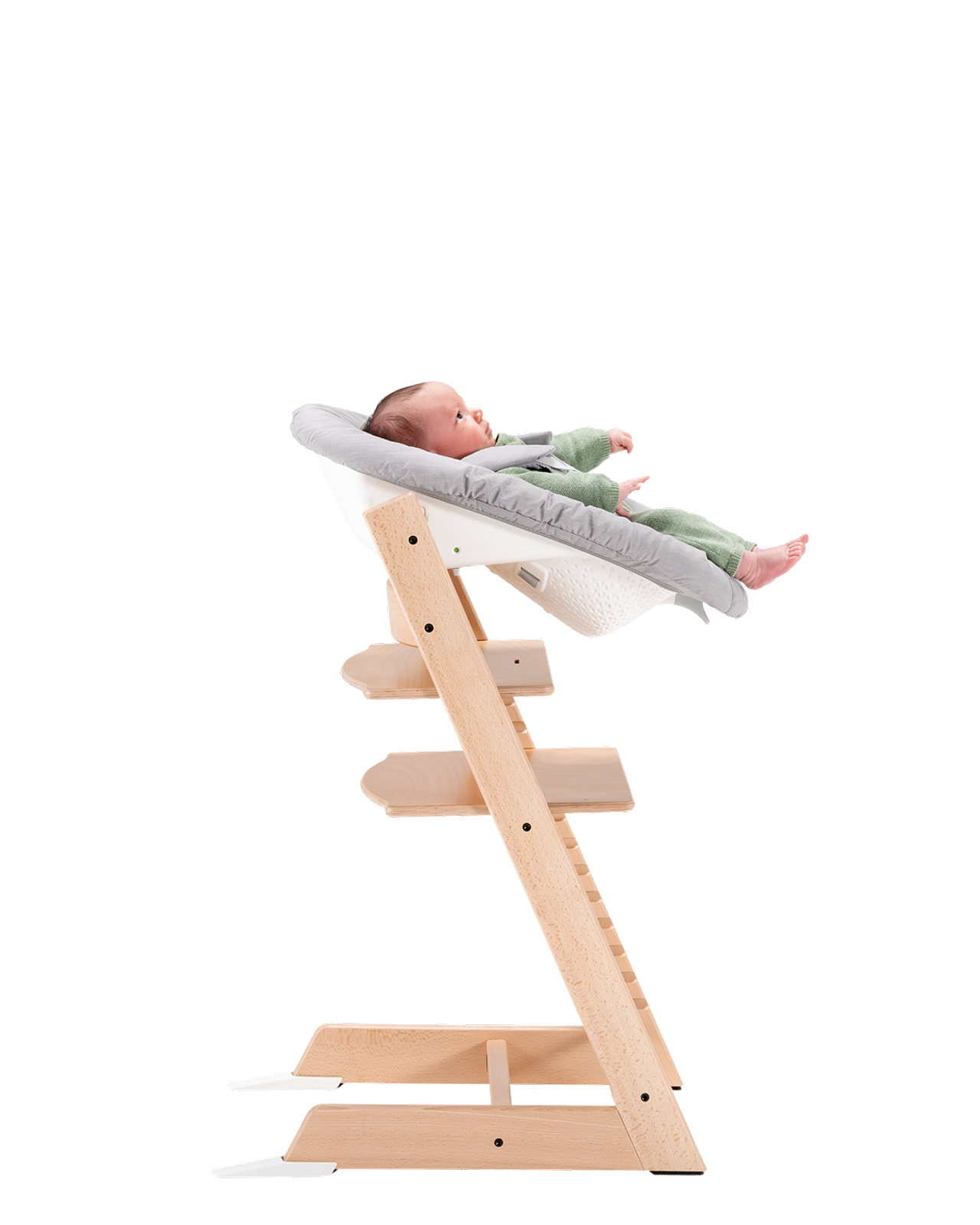 Baby in a Tripp Trapp high chair with Newborn Set.