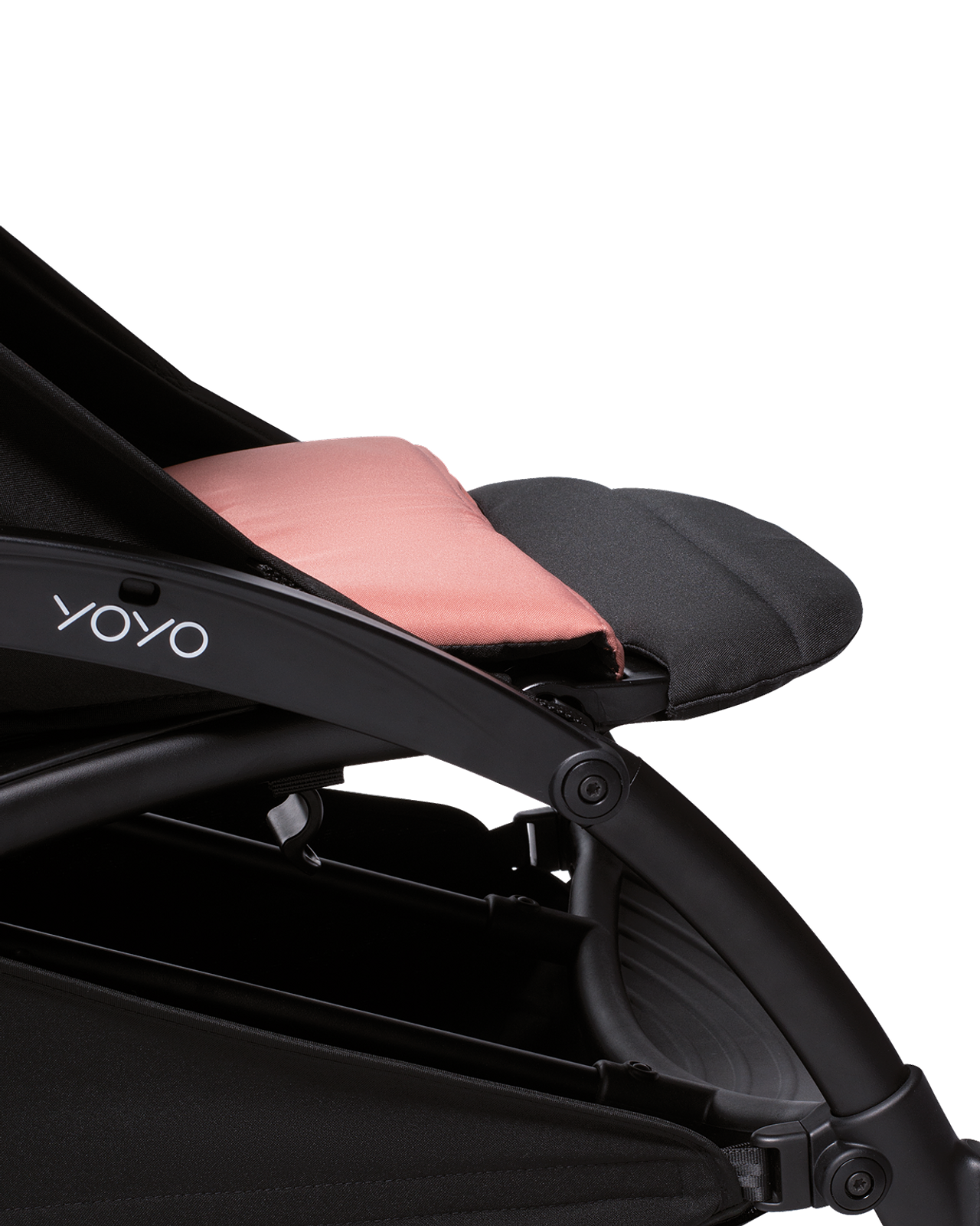 Close-up of a YOYO stroller with black fabric and a salmon-colored cushion.