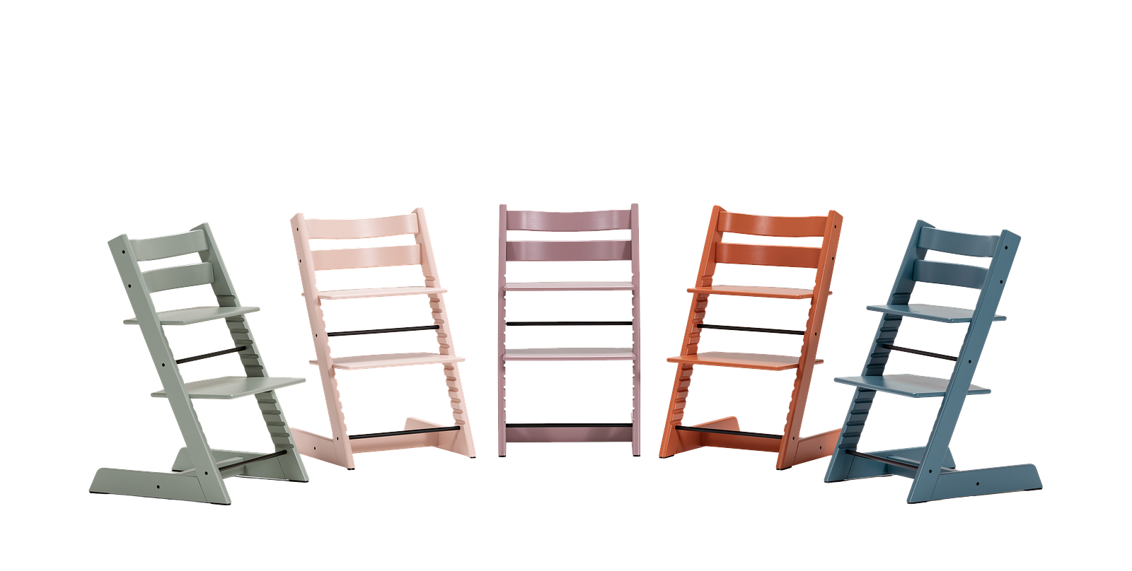 Five Tripp Trapp chairs in various colors: green, pink, lavender, orange, and blue.