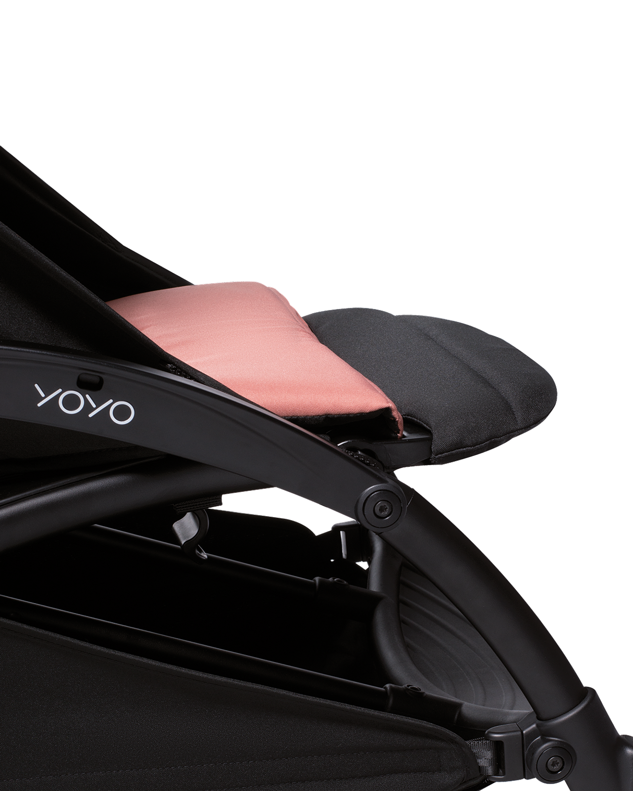 Close-up of a YOYO stroller with black fabric and a salmon-colored cushion.