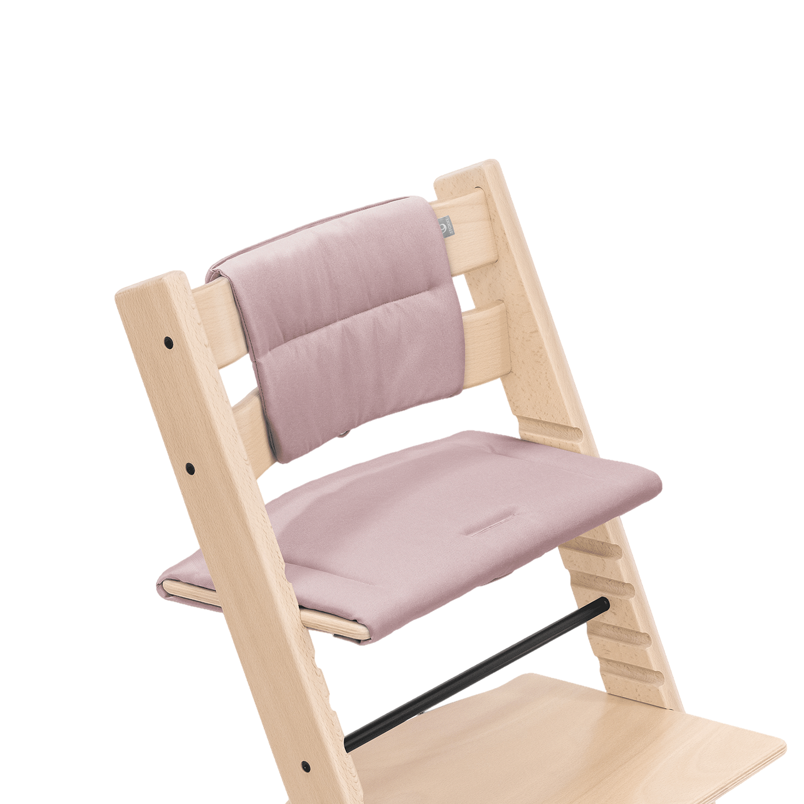 Tripp Trapp chair in natural wood with pink cushions.