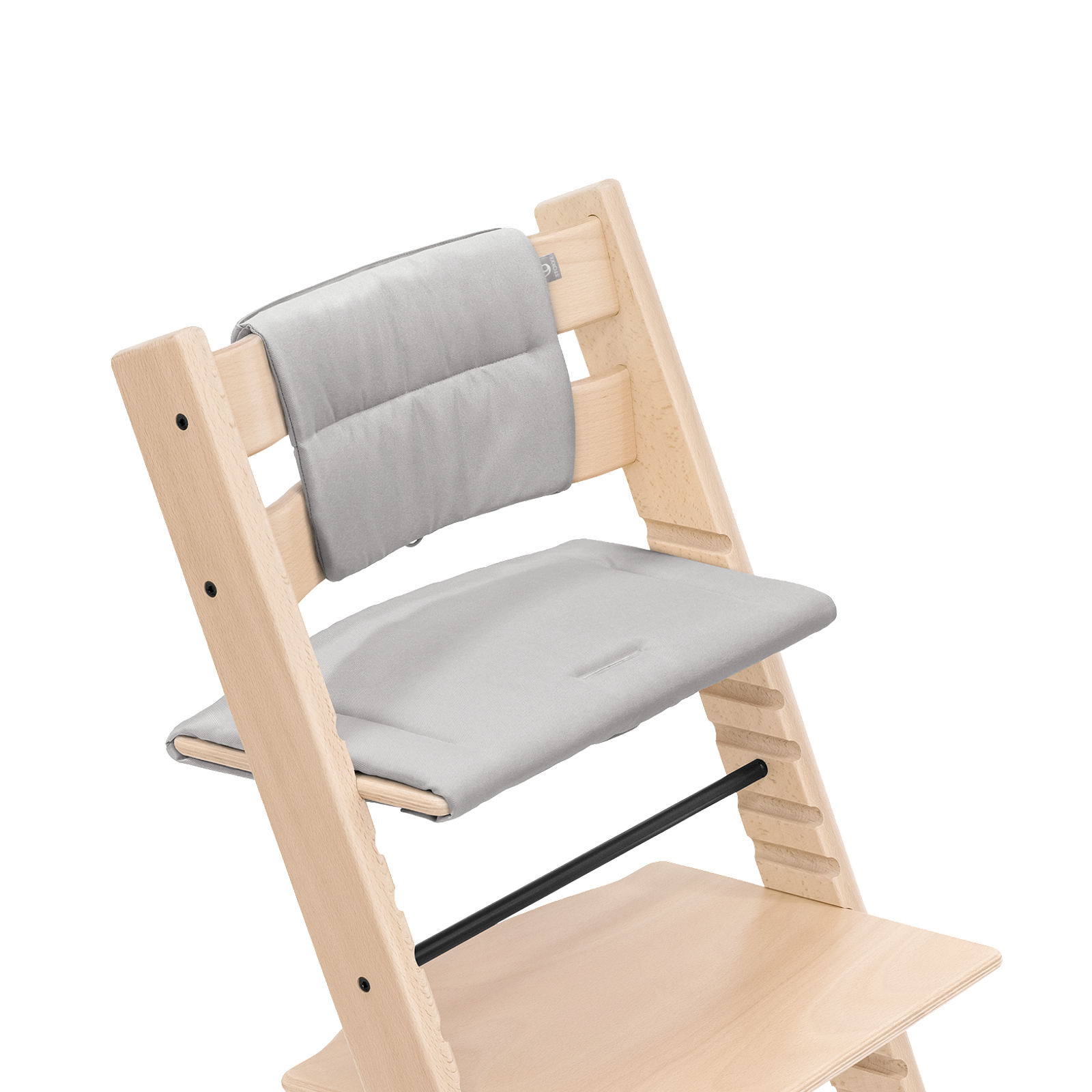 Light wood Tripp Trapp chair with light grey seat and back cushions.