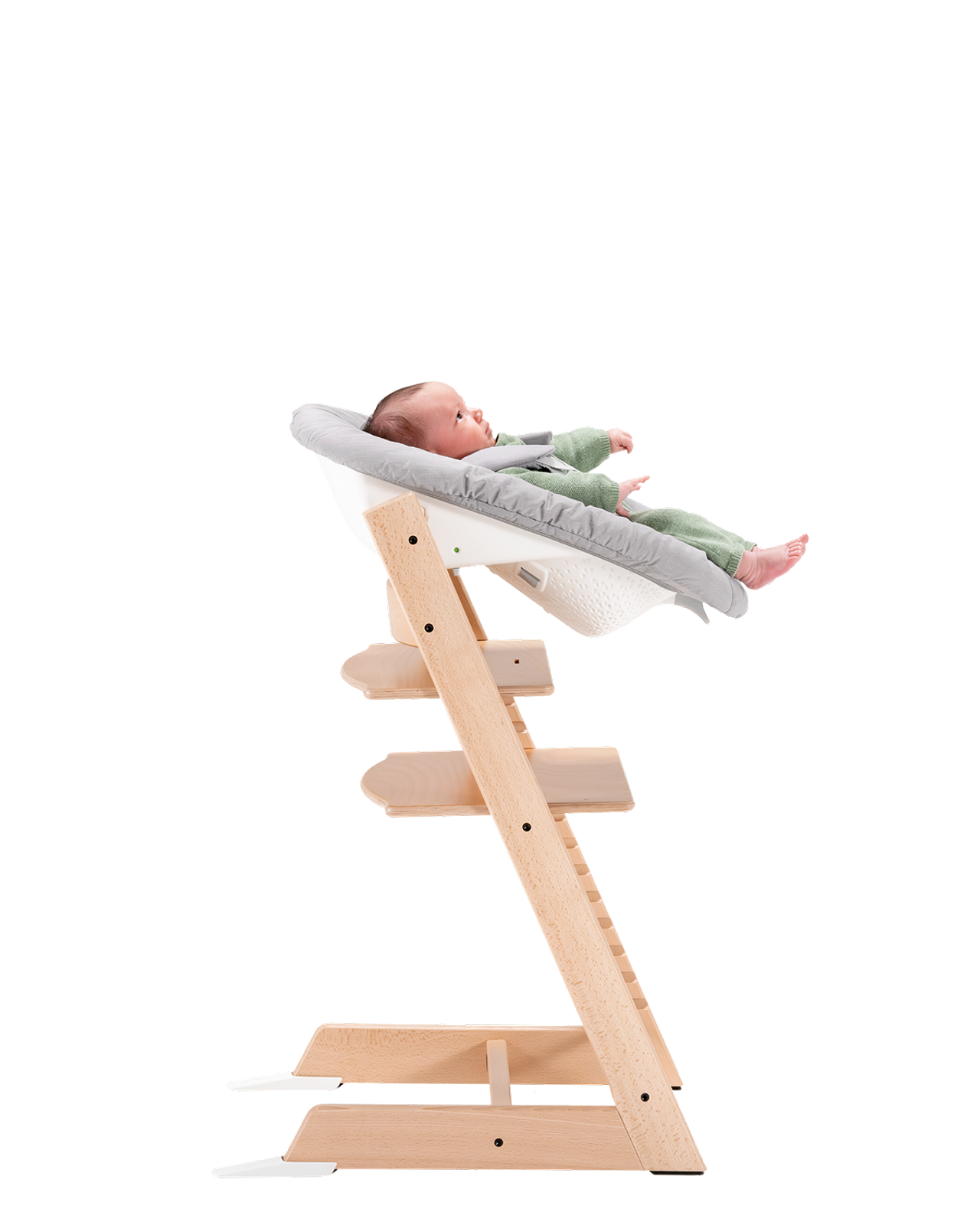Baby in a Tripp Trapp high chair with Newborn Set.