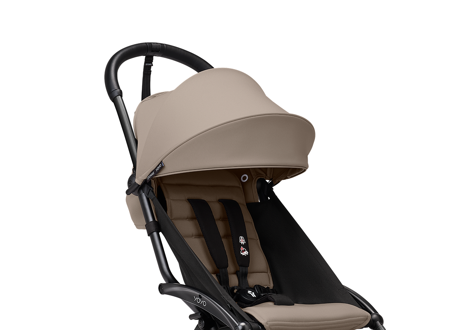 A beige and black STOKKE YOYO stroller against a black background.