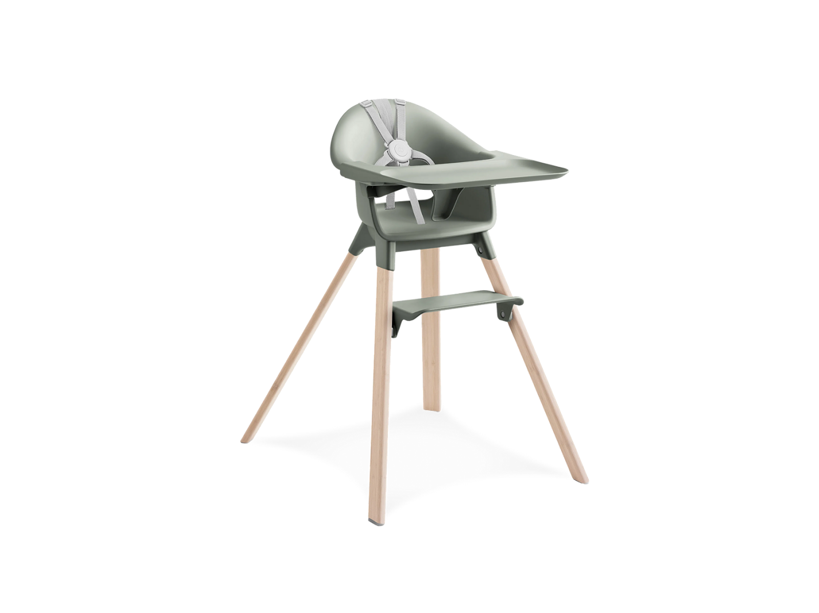A sage green high chair with a tray and footrest, supported by light wooden splayed legs.