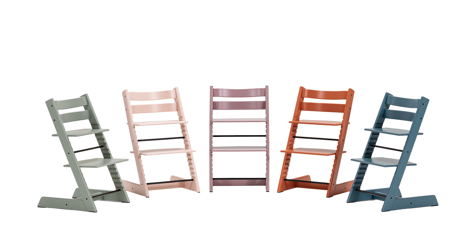 Five Tripp Trapp chairs in various colors: green, pink, lavender, orange, and blue.