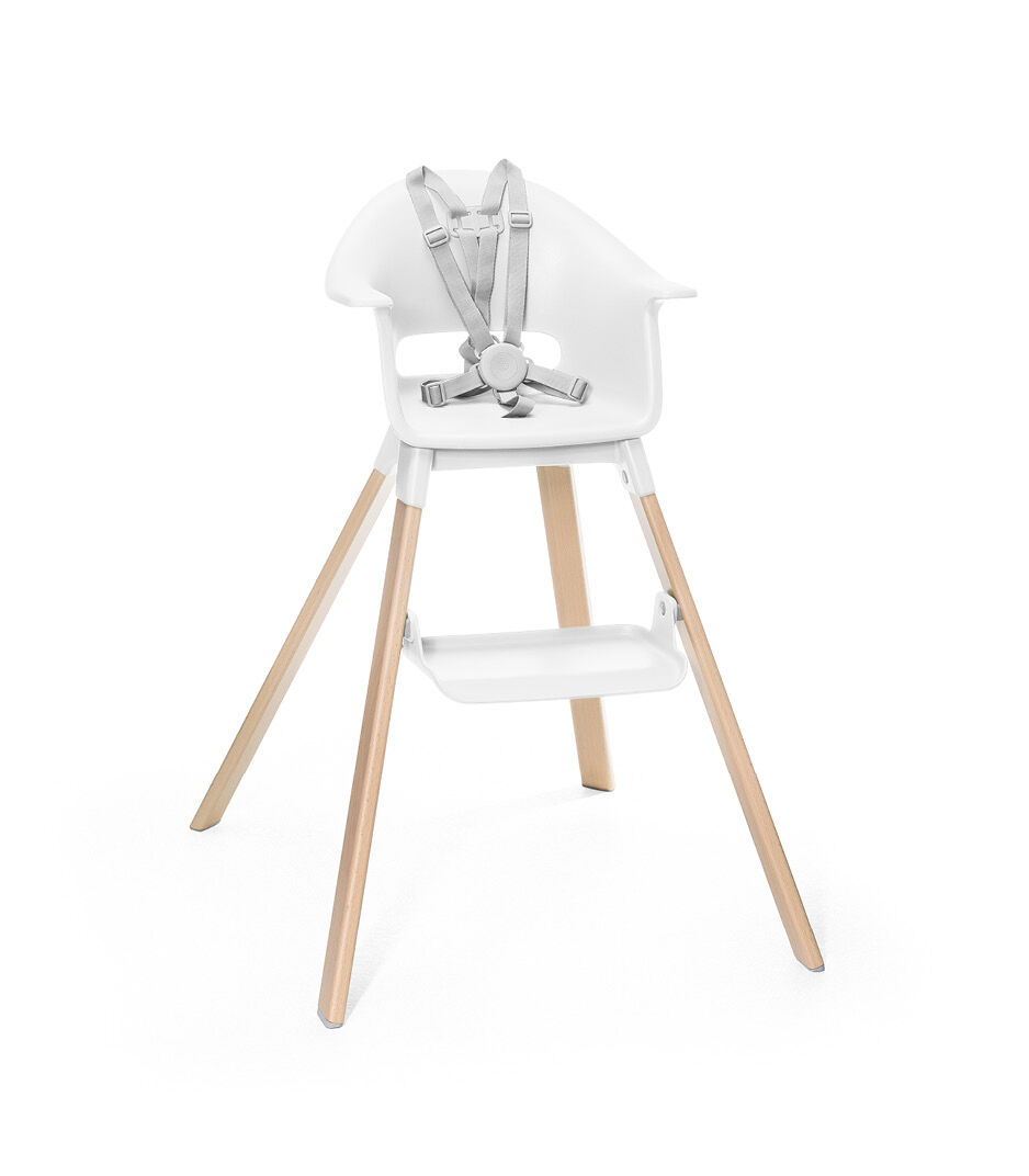 Stokke® Clikk™ High Chair. Natural Beech wood and White plastic parts. Stokke® Harness attached. Footrest high.