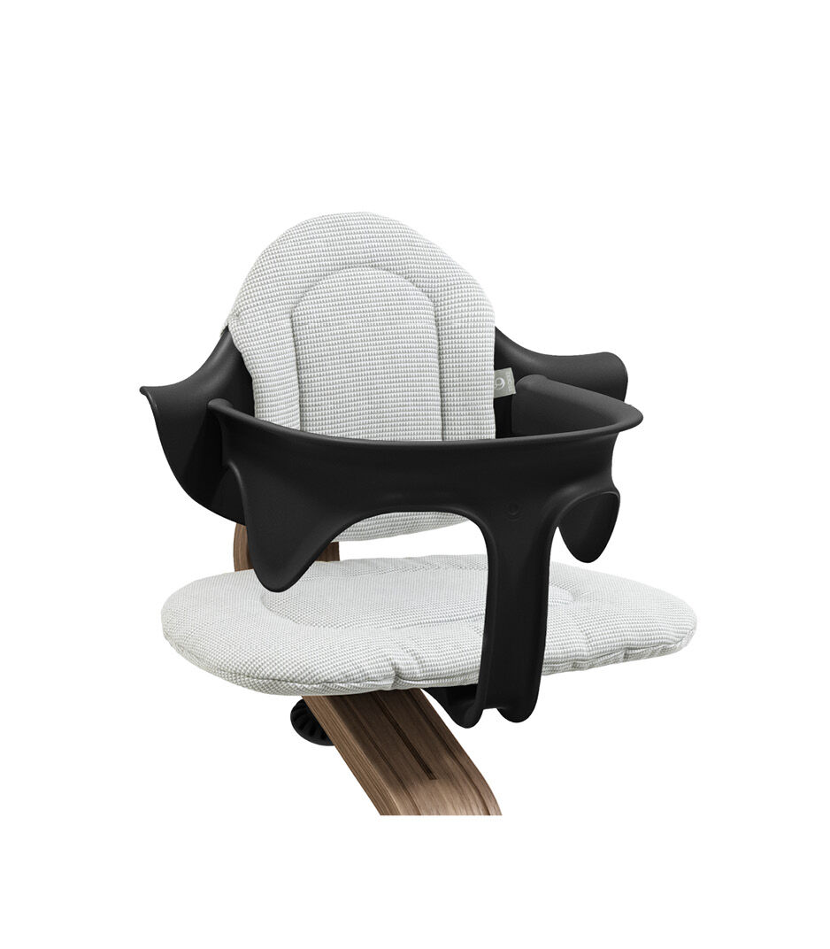 Stokke® Nomi® Chair. Premium Walnut wood and Black plastic parts. Baby Set. Cushion Nordic Grey. Close-up. galery image 3
