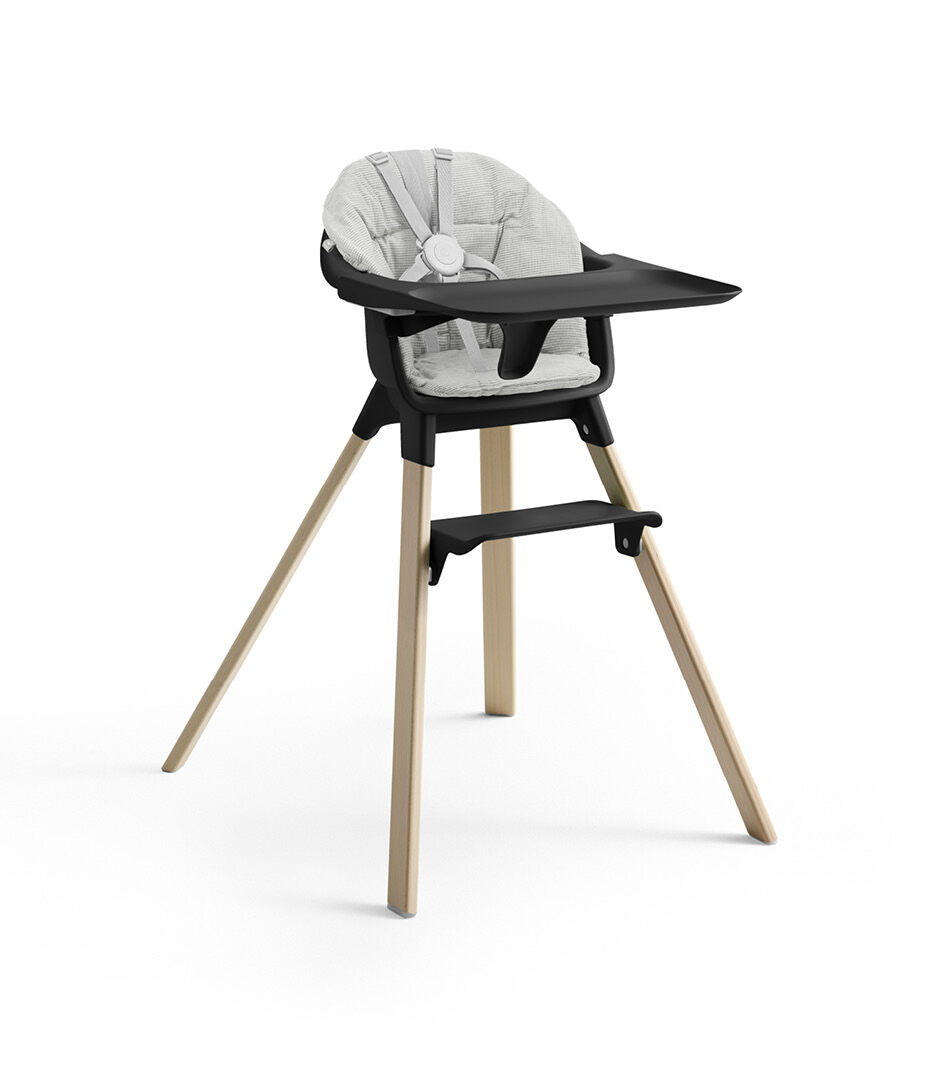 Stokke® Clikk™ High Chair with Tray and Harness, in Natural and Black. Cushion Nordic Grey.