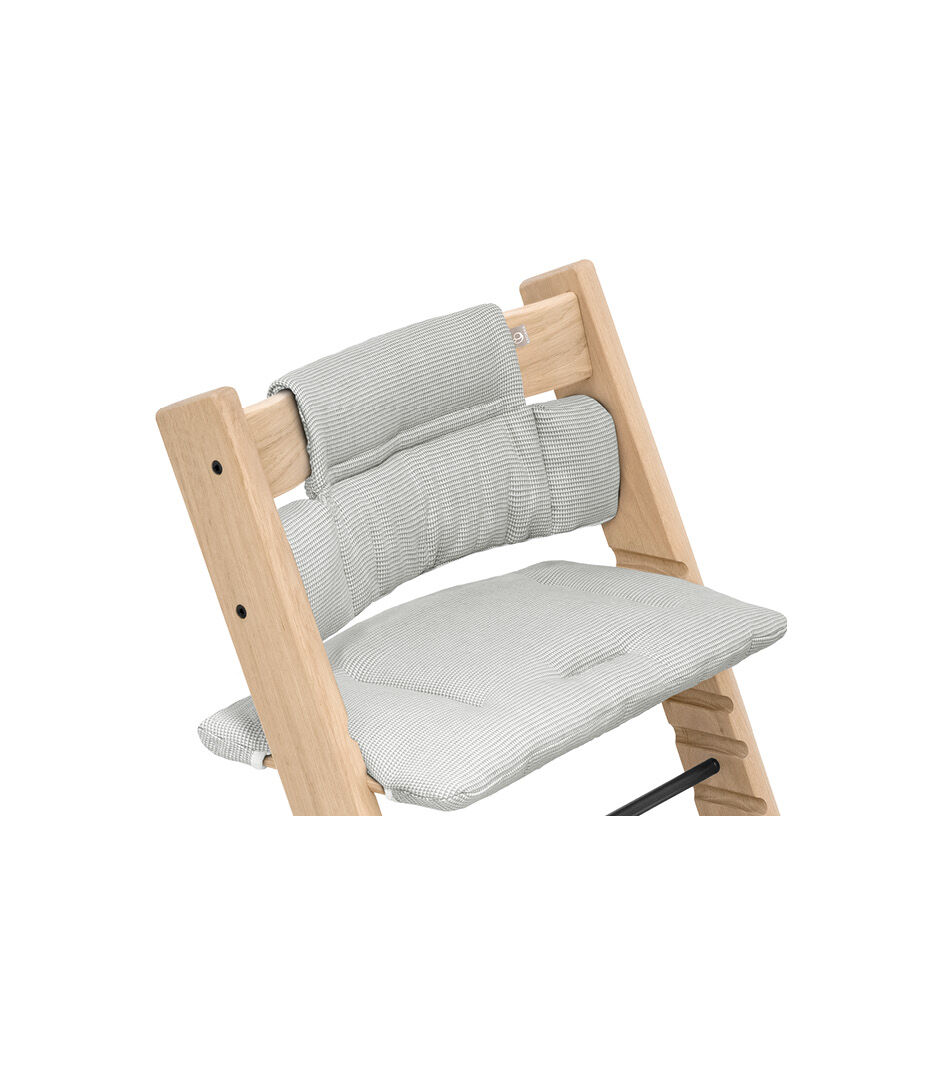 Tripp Trapp® chair Oak Natural, with Classic Cushion Nordic Grey.