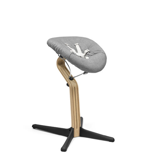 Stokke® Nomi® Chair. Premium Oak wood and Black plastic parts with Newborn Set, Grey textile cover. view 4