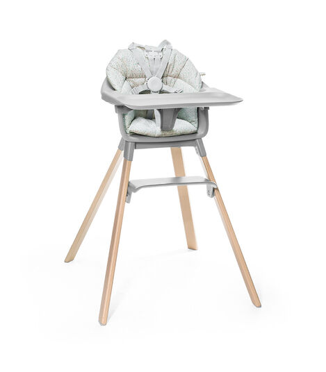 Stokke® Clikk™ High Chair. Natural Beech wood and Cloud Grey plastic parts including Tray. Cushion Grey Sprinkle and Harness. view 3