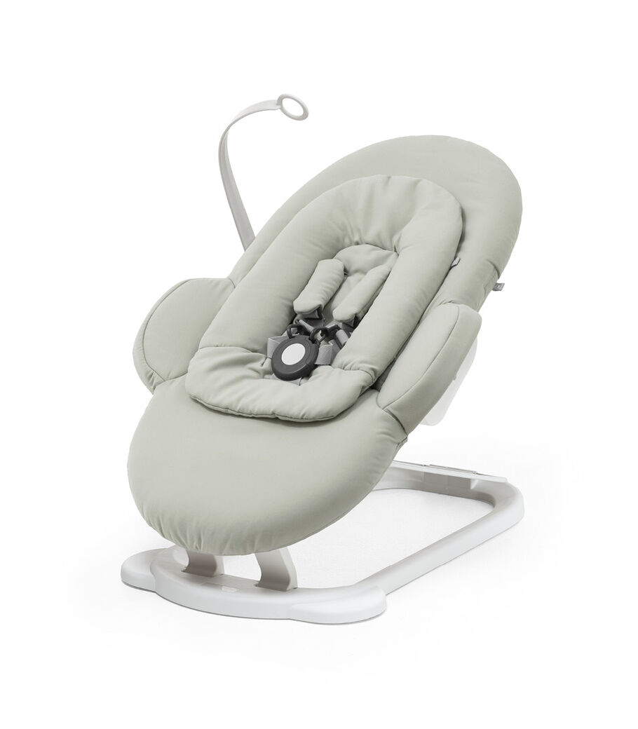 Stokke® Steps™ Bouncer, Soft Sage and White. On the Floor. view 9