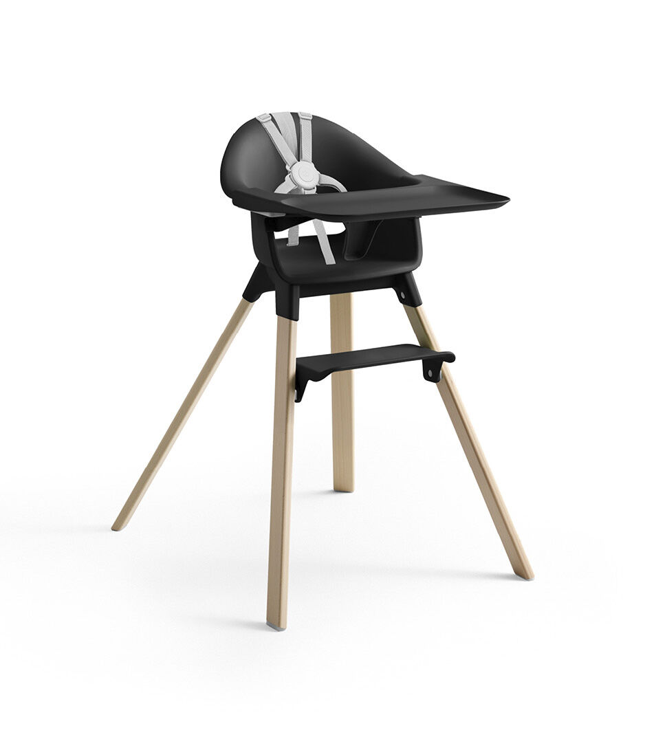 Stokke® Clikk™ High Chair with Tray and Harness, in Natural and Black.