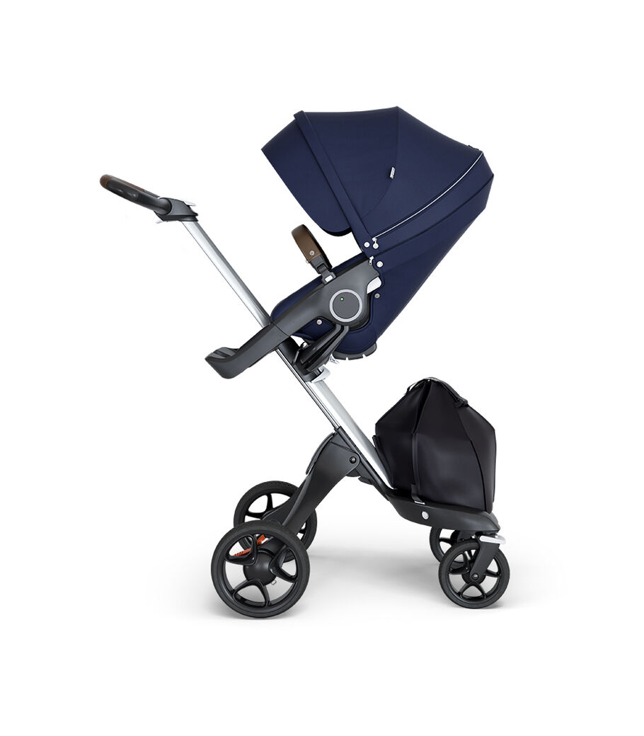 Stokke® Xplory® wtih Silver Chassis and Leatherette Brown handle. Stokke® Stroller Seat Deep Blue. view 13