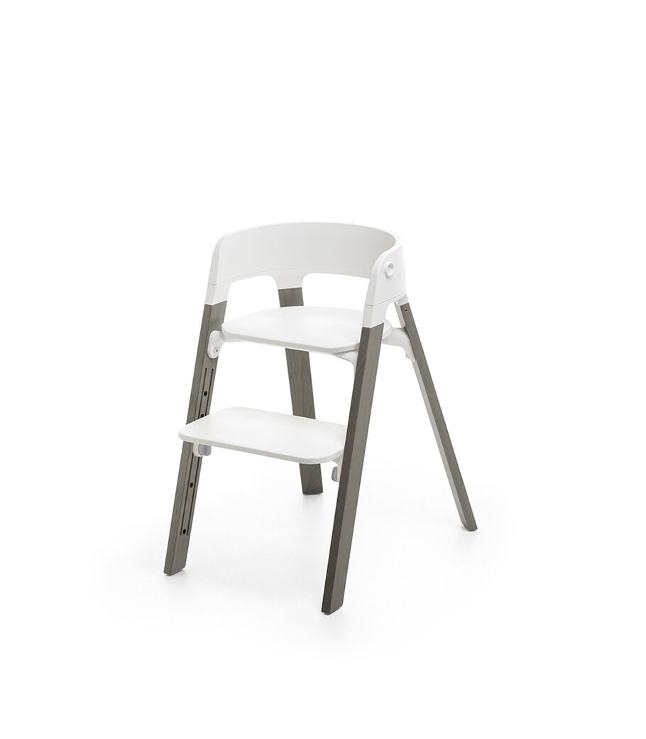 Stokke&reg; Steps&trade; Hazy Grey  with white seat and footrest in high position.