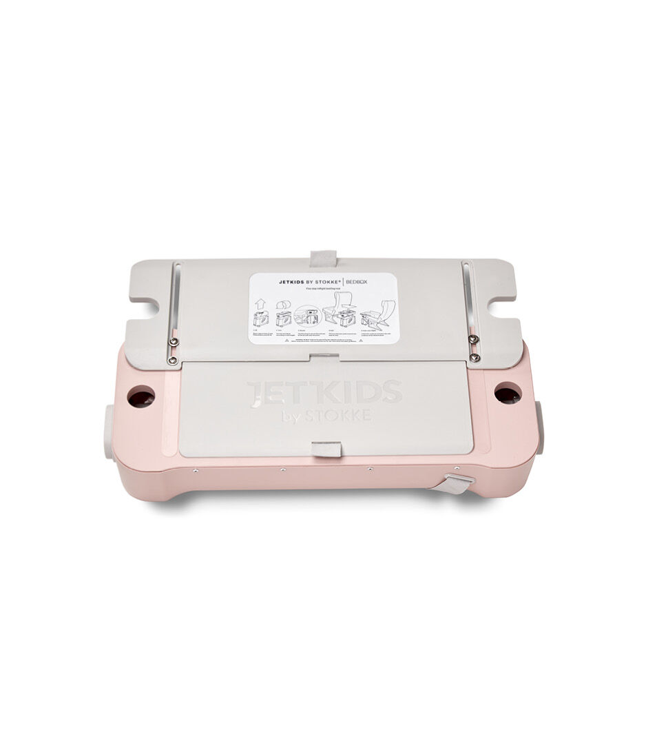 JetKids by Stokke® RideBox Pink Lemonade. Lid with extendable plate, closed.