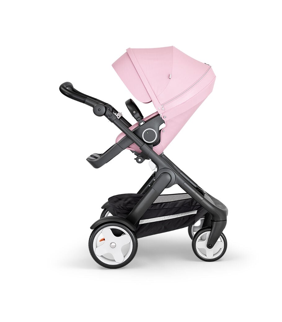 Stokke® Trailz™ with Black Chassis, Black Leatherette and Terrain Wheels. Stokke® Stroller Seat, Lotus Pink view 15