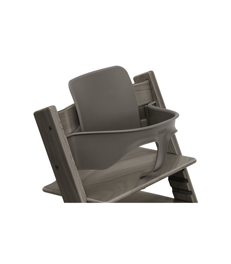Tripp Trapp® Chair Hazy Grey with Baby Set. Close-up.