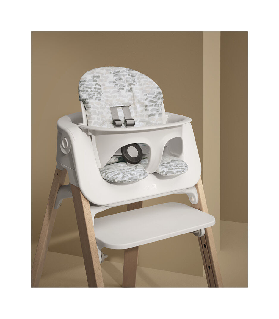 Stokke® Steps™ Natural with Baby Set and Cushion Waves Grey. Styled.