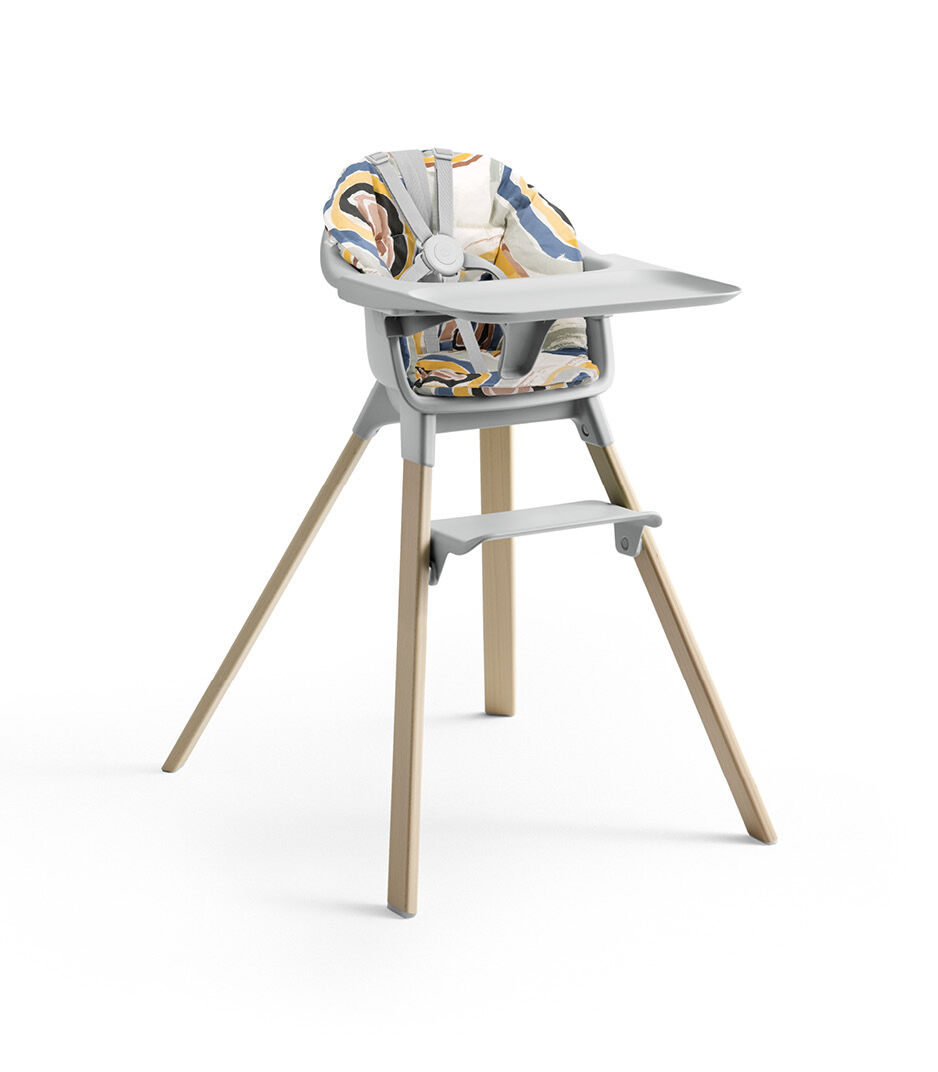 Stokke® Clikk™ High Chair with Tray and Harness, in Natural and Cloud Grey. Cushion Multi Circle.