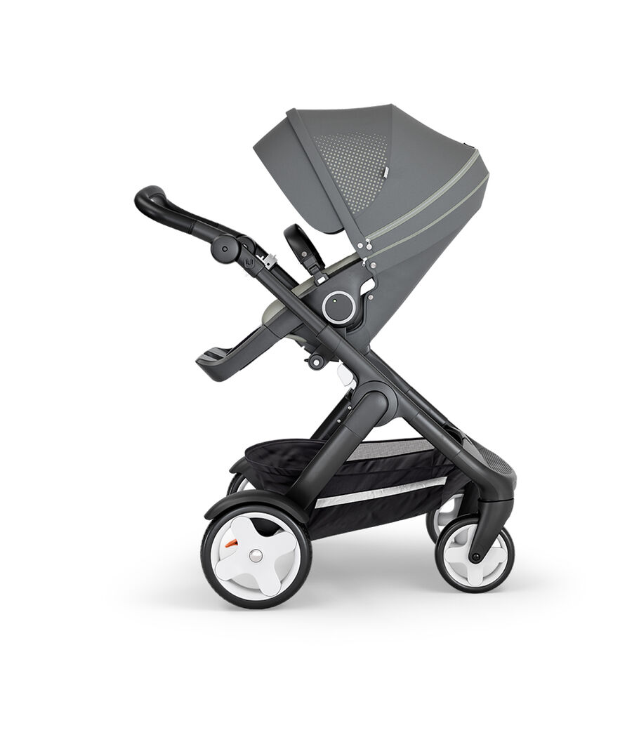 Stokke® Trailz™ with Black Chassis, Black Leatherette and Classic Wheels. Stokke® Stroller Seat, Athleisure Green. view 20