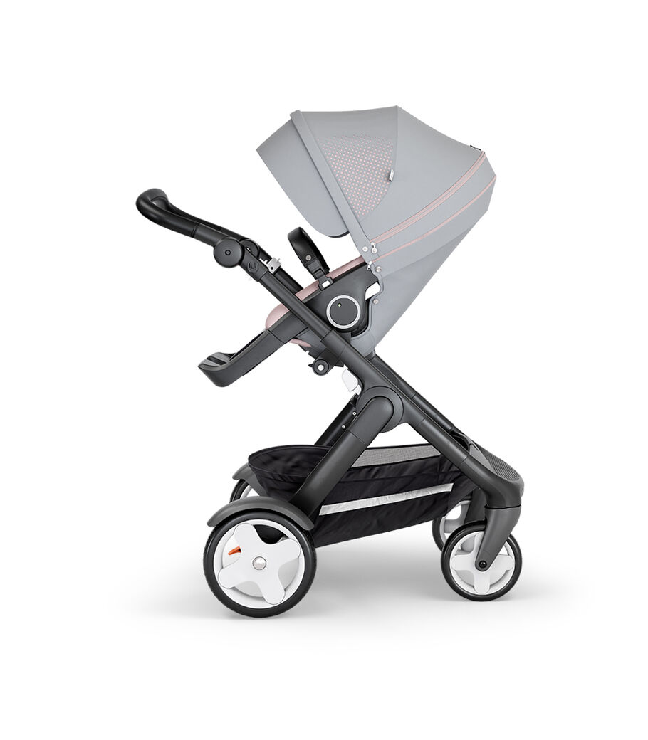 Stokke&reg; Trailz&trade; with Black Chassis, Black Leatherette and Classic Wheels. Stokke&reg; Stroller Seat, Athleisure Pink.