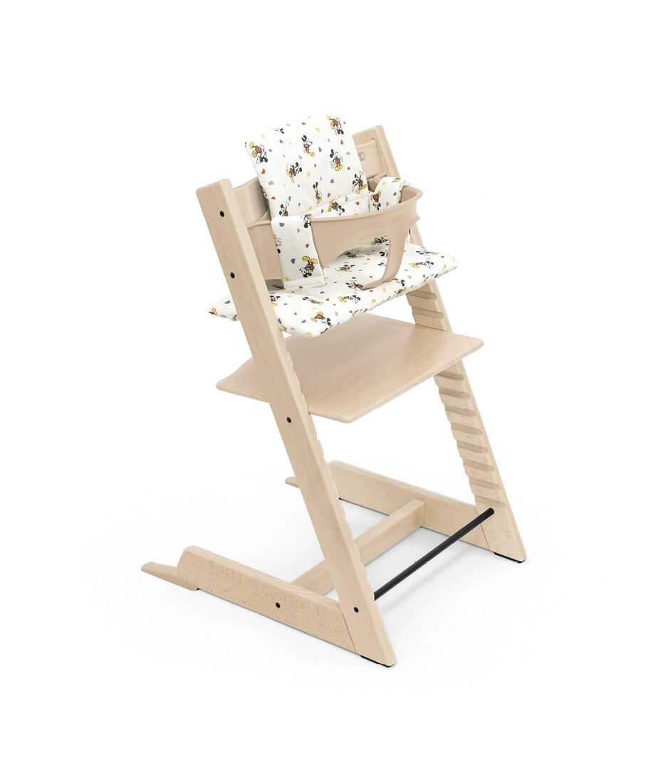 Tripp Trapp® chair Natural, with Baby Set and Classic Cushion Disney Mickey Celebration.