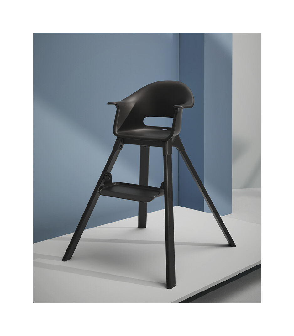 Stokke® Clikk™ High Chair. Midnight Black. Black with Black Beech legs. Styled.