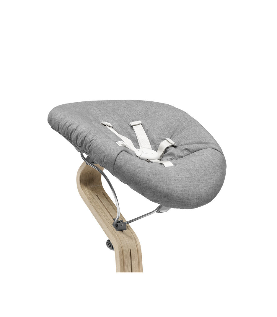 Stokke® Nomi® Chair Natural-Grey with Newborn Set Grey. Close-up.