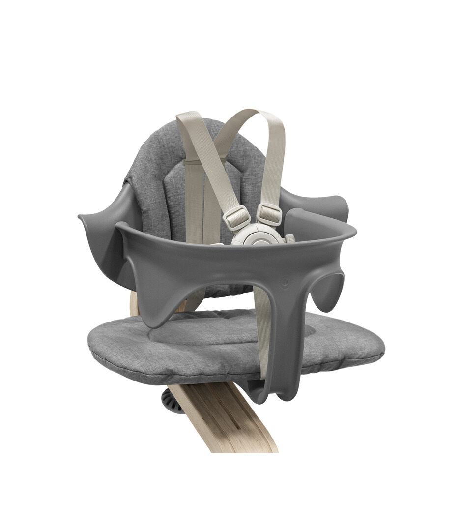 Stokke® Nomi® Chair Natural-Grey with Baby Set and Grey Cushions. US variant w/Harness. Close-up