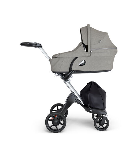 Stokke® Xplory® wtih Silver Chassis and Leatherette Black handle. Stokke® Stroller Seat Carry Cot Brushed Grey. view 2