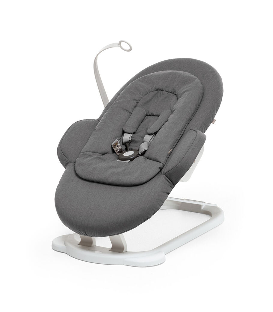 Stokke® Steps Bouncer in Deep Grey with White Base and Toy Hanger. view 13
