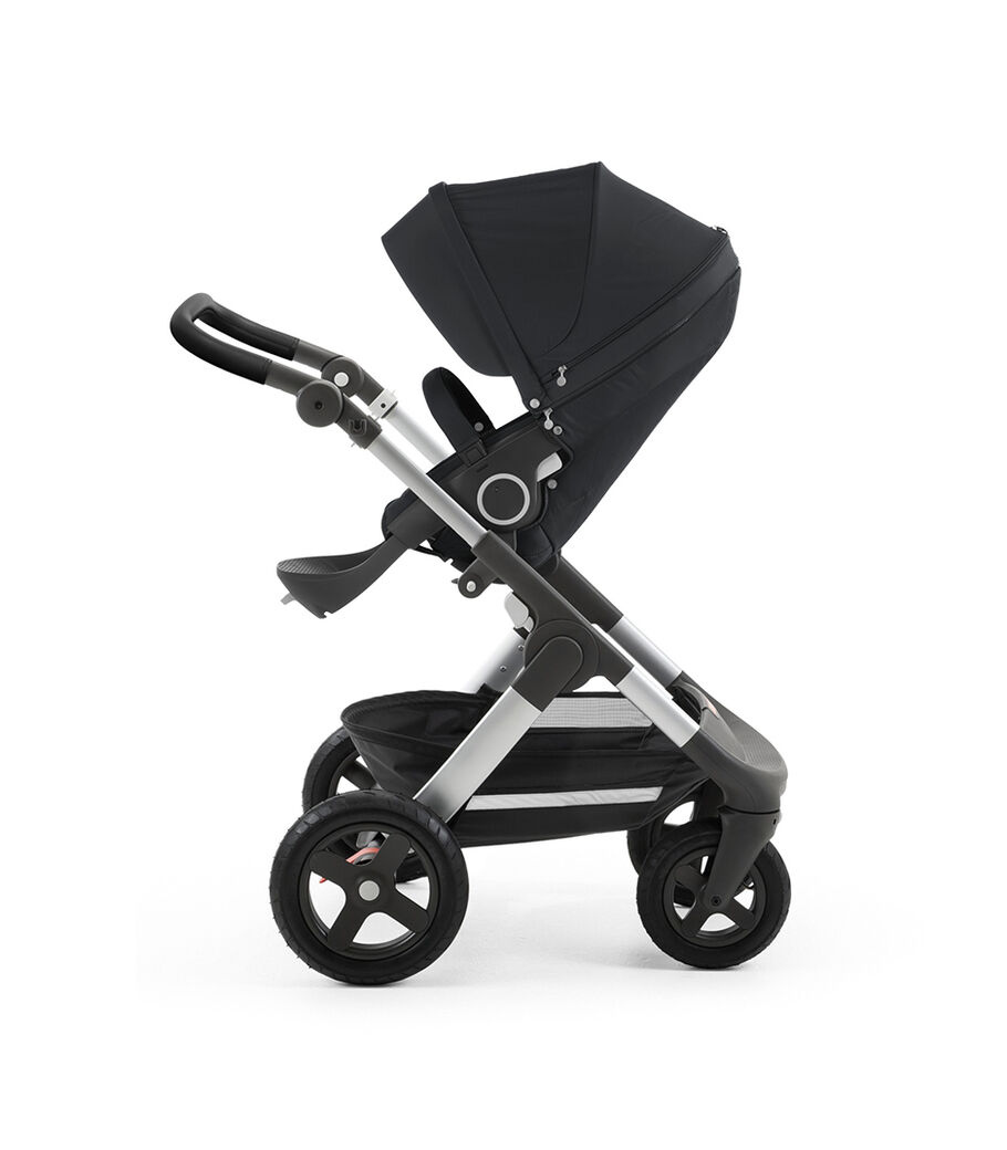Stokke® Trailz™ with silver chassis and Stokke® Stroller Seat, Black. Leatherette Handle. Terrain Wheels. view 36