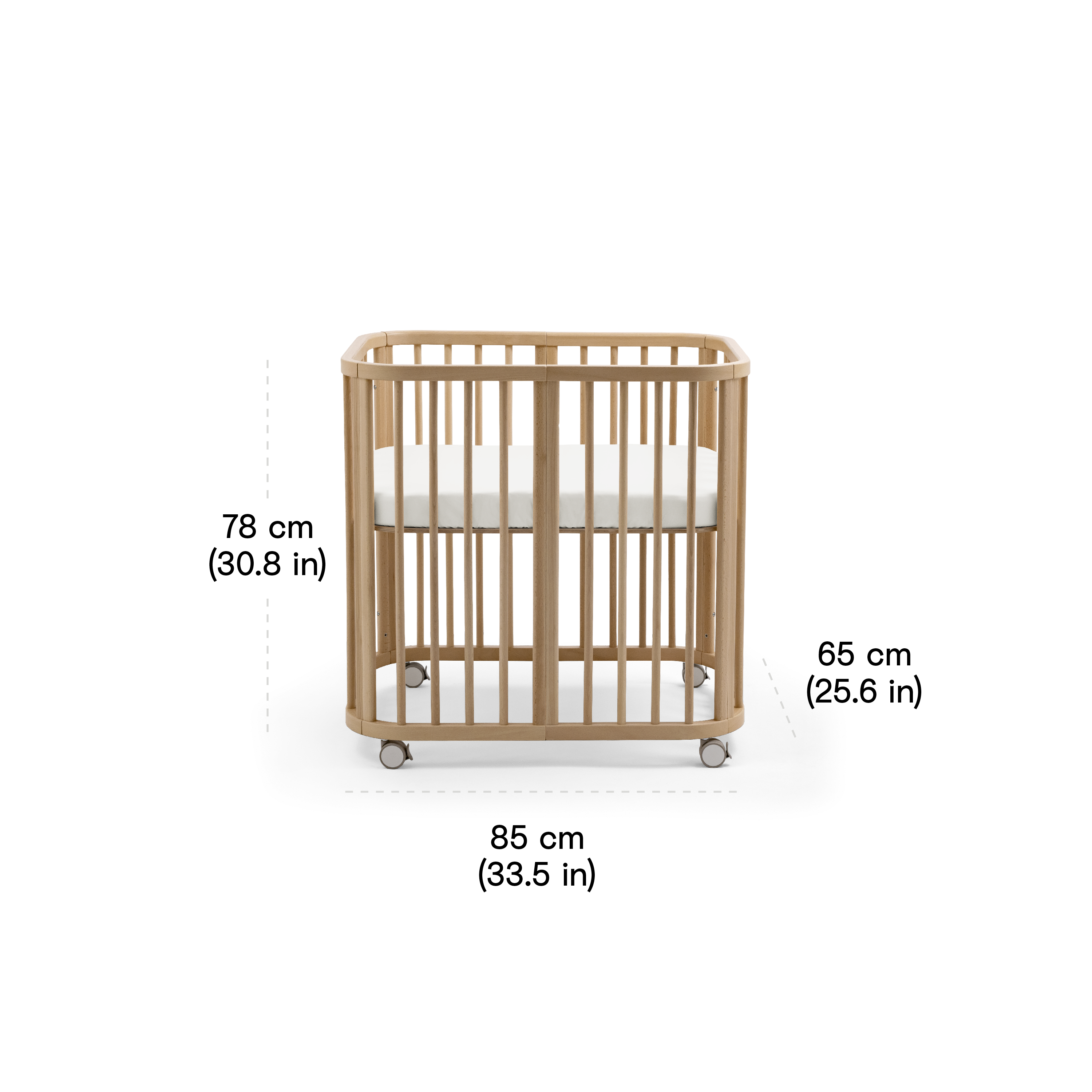 Stokke Nighti™ Mini Newborn Cot in a calm, modern nursery with a slim rectangular frame and visible wheels, showing its compact space-efficient footprint in a small room.