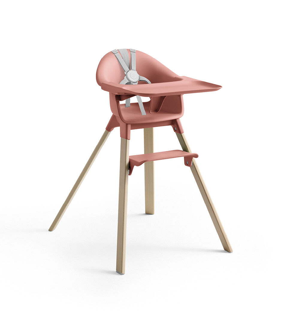 Stokke® Clikk™ High Chair with Tray and Harness, in Natural and Sunny Coral.