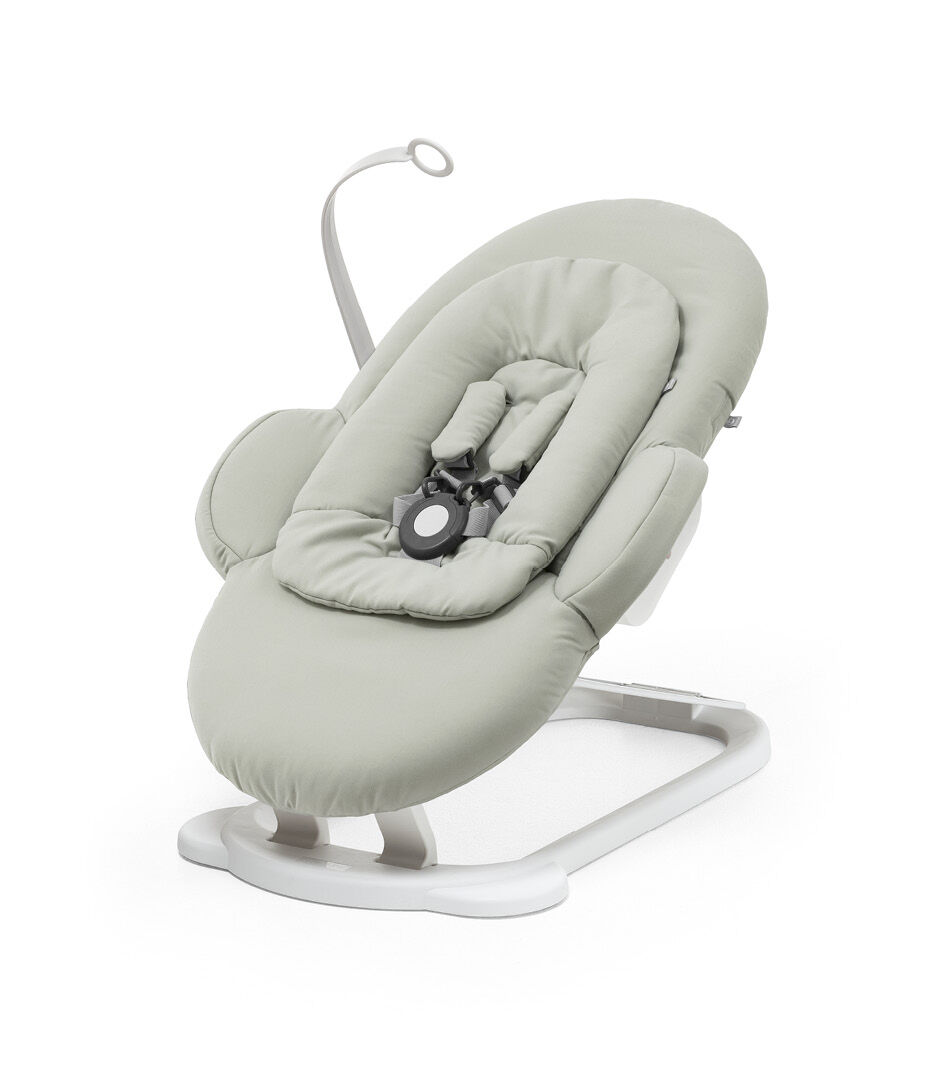 Stokke® Steps™ Bouncer, Soft Sage and White. On the Floor.