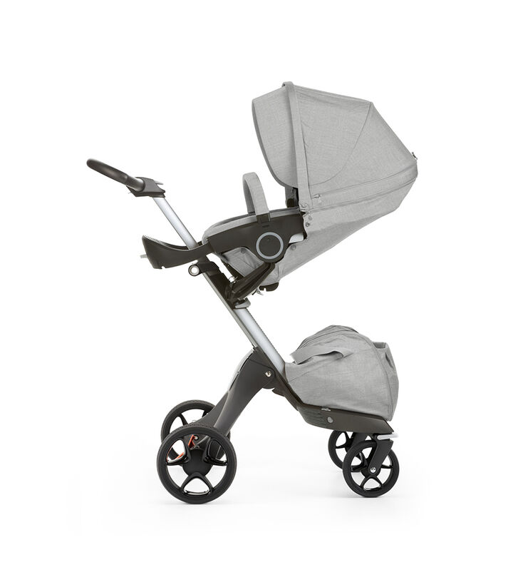Stokke® Xplory® with Stokke® Stroller Seat, parent facing, sleep position. Grey Melange. New wheels 2016. view 1