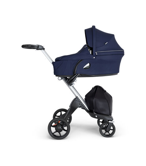 Stokke® Xplory® wtih Silver Chassis and Leatherette Black handle. Stokke® Stroller Carry Cot Deep Blue. view 2