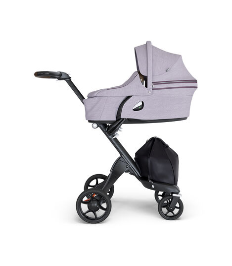 Stokke® Xplory® wtih Black Chassis and Leatherette Brown handle. Stokke® Stroller Carry Cot Brushed Lilac. view 3
