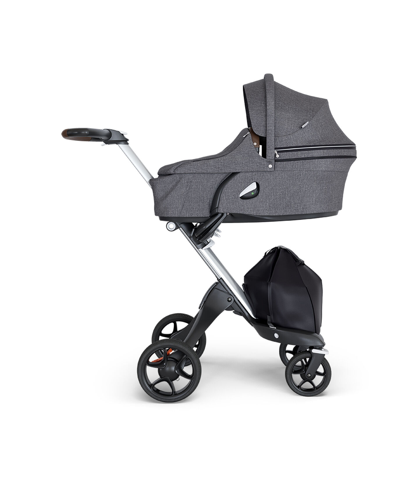 Stokke&reg; Xplory&reg; wtih Silver Chassis and Leatherette Brown handle. Stokke&reg; Stroller Carry Cot Black Melange.