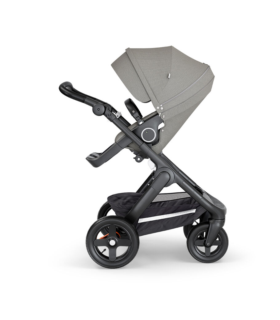 Stokke&reg; Trailz&trade; with Black Chassis, Black Leatherette and Terrain Wheels. Stokke&reg; Stroller Seat, Brushed Grey.