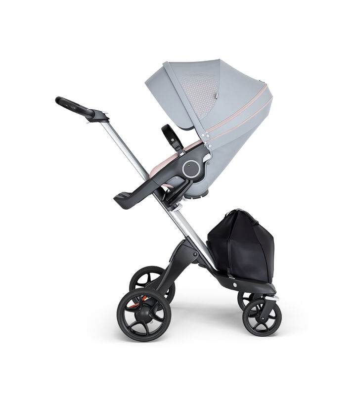Stokke® Xplory® wtih Silver Chassis and Leatherette Black handle. Stokke® Stroller Seat Athleisure Pink. view 1