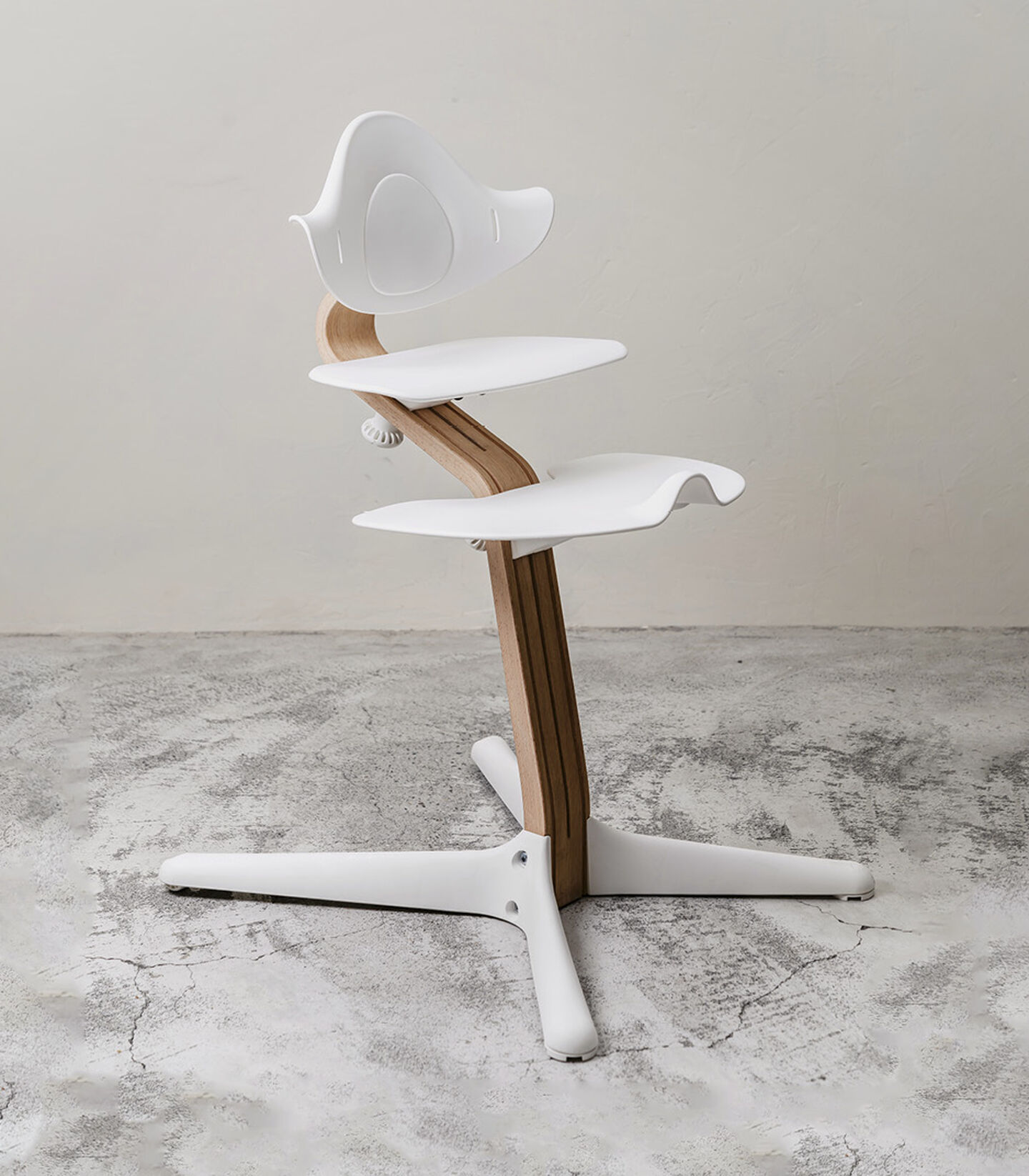 Stokke® Nomi® Chair. Oak premium wood and White plastic parts. Styled. view 4