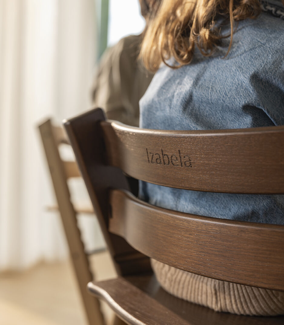 Tripp Trapp® Oak Warm Brown chair with engraving. Close-up. galery image 5